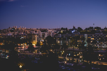 Obraz premium Night view of the skyline of the hills of Valparaiso and Viña del Mar with beautiful lights and Marga Marga river, Chile