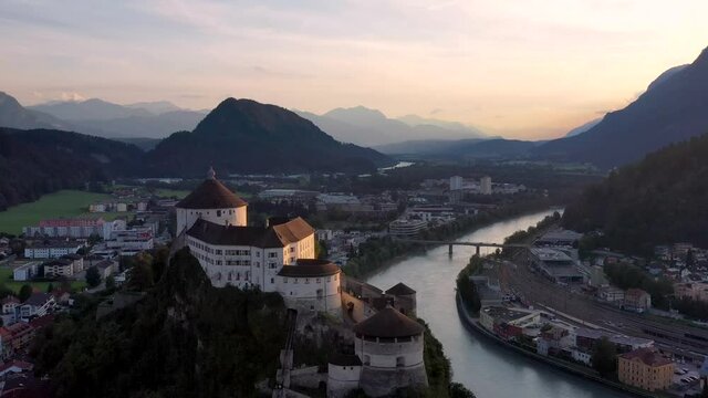 Aerial view of mountain town Kufstein with hilltop fortress,  summer scenery at sunset, river Inn, Austrian Alps from above, Tyrol, Austria, Europe