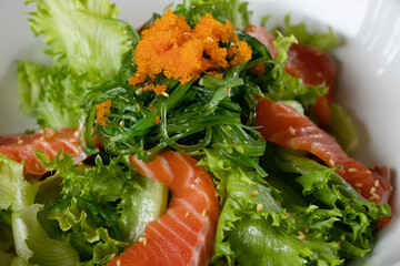 salmon salad japanese style with Sesame Dressing.Fusion food.
