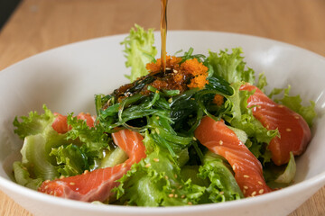 salmon salad japanese style with Sesame Dressing.Fusion food.