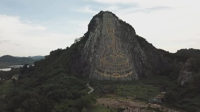 PATTAYA, THAILAND - 130 meter high Golden Buddha laser carved and inlayed with gold on Khao Chi Chan Cliff, Pattaya, Chonburi, Thailand (aerial photography)
