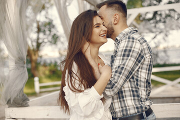 Beautiful couple spend time in a summer park