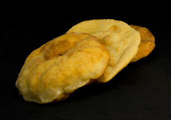 Creole fried cakes ( tortas fritas ) typical Argentine food. black background