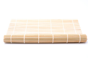 bamboo mat for making japanese sushi isolated on white background