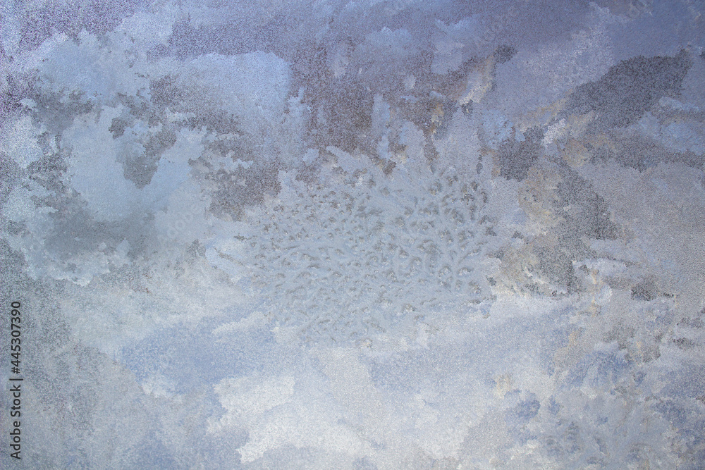Aufkleber Textured frost patterns on the glass. Ice crystals on the window on a cold, frosty day in winter.
