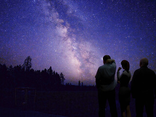 3d Computer rendered illustration of people gazing at the milky way