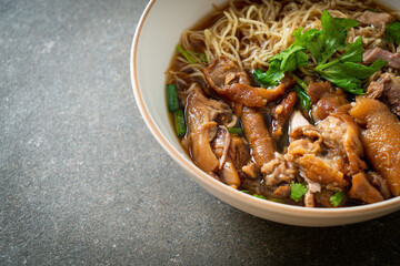 Stewed pork leg noodles in brown soup