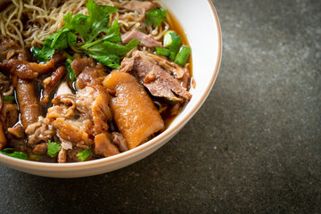 Stewed pork leg noodles in brown soup
