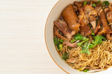 Stewed pork leg noodles in brown soup