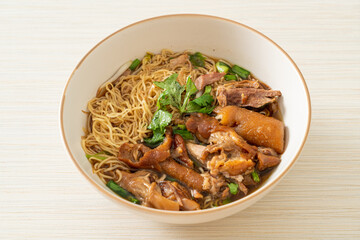 Stewed pork leg noodles in brown soup