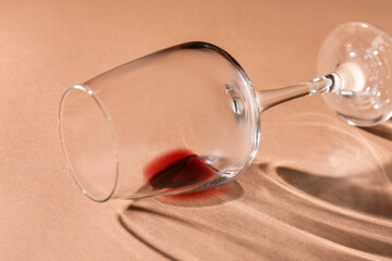 Glass of red wine on color background, closeup