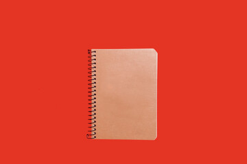 beige spiral notebook. school and office accessories