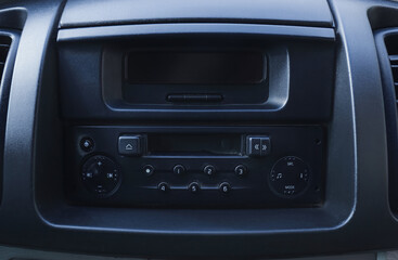 Modern radio on dashboard of car, closeup