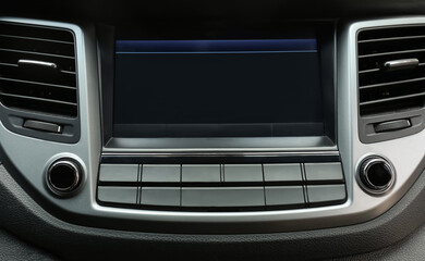 Modern radio on dashboard of car, closeup