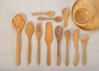 Kitchenware set of wooden spoon and fork on wood background.