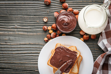 toasts with chocolate butter on a dark wooden rustic background