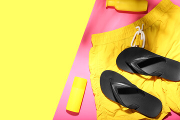 Set of beach accessories and cosmetics on color background
