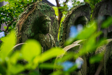Old mossy Jizo statues.