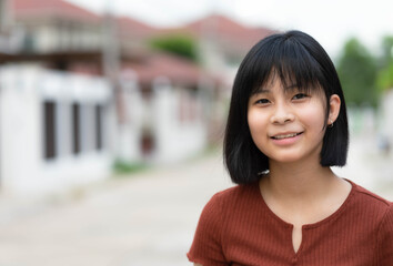 Portrait of young beautiful Asian woman feeling happy.outdoor concept.