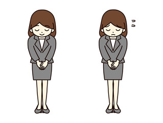 お辞儀をするスーツの若い女性