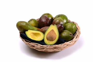 Fresh avocado in basket. Healthy fruits concept.