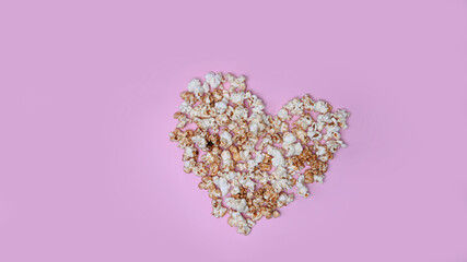 Fresh popcorn isolated on pink background.