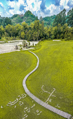 Thung Na Mui Bridge in the rice terraces in Nakhon Nayok, Thailand