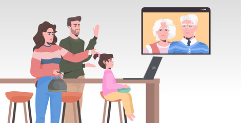 young family having virtual meeting with grandparents during video call chat online conference