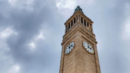 Fototapeta na wymiar The clock tower in the Brisbane CBD looks amazing by itself and its building has been taken care of extremely well. It found in King George Square