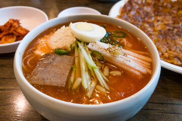 the korea style cold kimchi noodles soup.