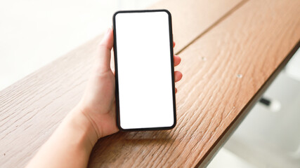 Cropped shot view of Women's hands holding cell telephone blank copy space screen. smart phone with technology concept.