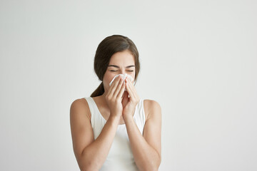 woman wipes her nose with a handkerchief runny nose health problems health cold