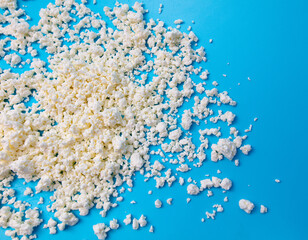 Milk curd on a blue background.