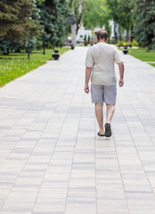 A man in shorts walks