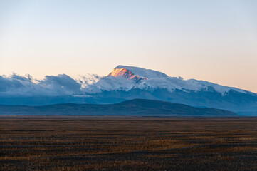 Snow mountain landscape at sunrise in Tibet