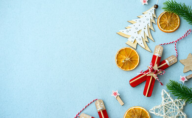 Fototapeta na wymiar Christmas composition of wooden Christmas tree toys on a blue background