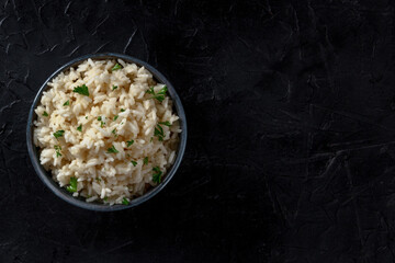 Rice, top shot on a black background with a place for text