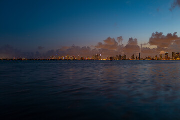 Naklejka premium Miami at sunset. Miami Florida, colorful skyline of Macarthur causeway.