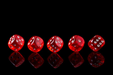 Red casino dice isolated over black reflective background