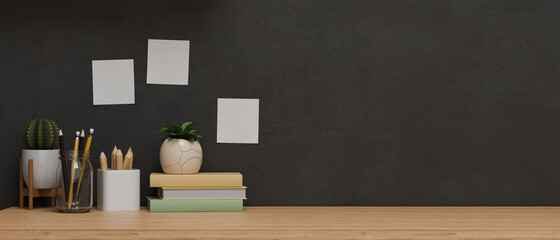 Copy space for product display on wooden table with decorations and black wallpaper, working corner