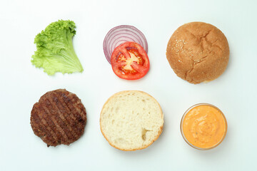 Concept of cooking burger on white background, top view