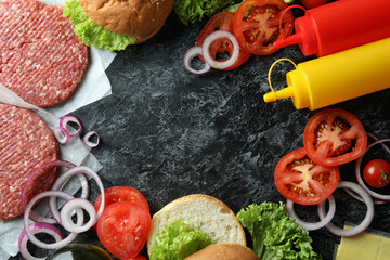 Concept of cooking burger on black smokey table