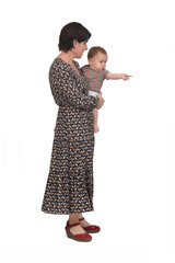 side view of a mother carrying her baby pointing on white background