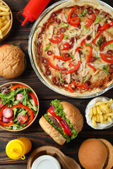 Concept of fast food on wooden table