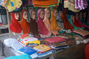 Mannequins with hijabs at market in Sumatra. Islamic women’s headscarf as a religious veil. Dumai, Indonesia.