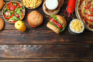 Concept of fast food on wooden table