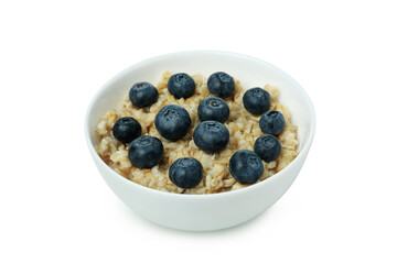Bowl of oatmeal with tasty ingredients isolated on white background