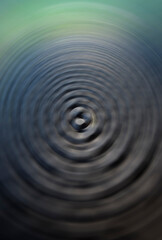 Soft ripple action of sound sonic wave formed in centre, colourful tones ranged from lightness to darkness, rounded and mixed in background. Abstract in shape, form and meaning. Beautiful indeed.