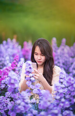 Teenager in a beautiful Margaret flower field,