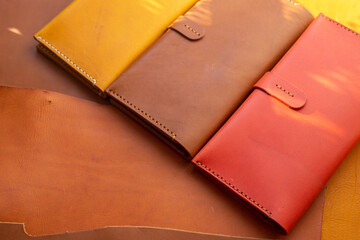 Colorful long wallet leather handmade on leather background